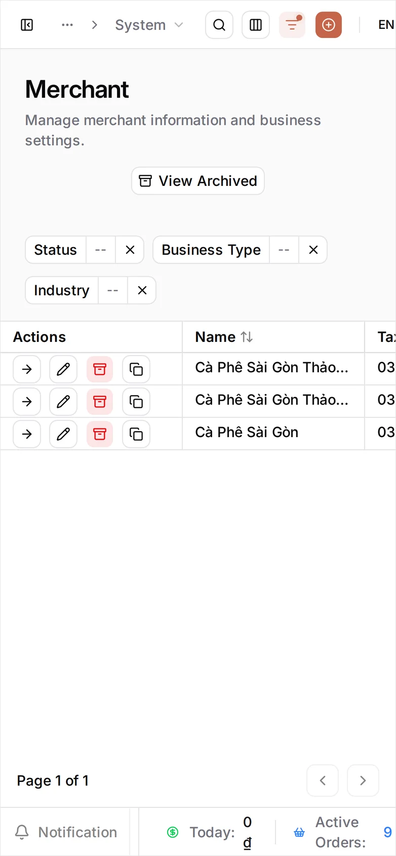 The same Merchant list at phone width. The table does not reflow, so only Actions and Name are on screen — one row, Cà Phê Sài Gòn, with its three icon actions; Tax Code and the rest are cut off to the right