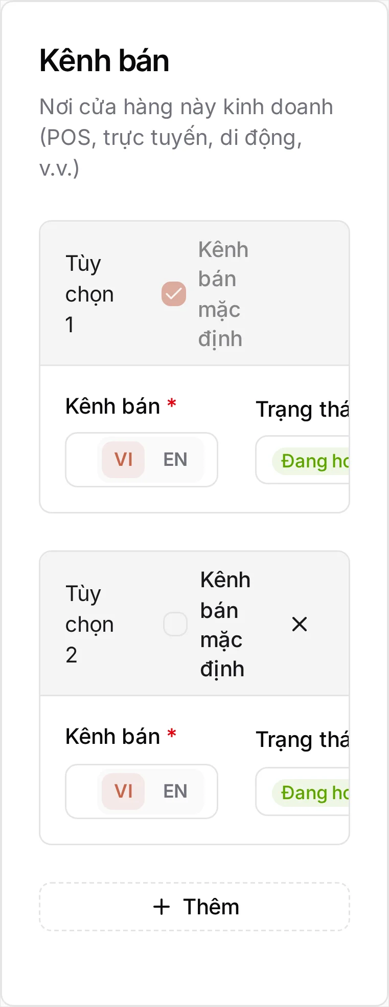 Thẻ Kênh bán — 'Nơi cửa hàng này bán hàng (POS, online, mobile, v.v.)' — gồm Lựa chọn 1 là Tại chỗ được tích làm Kênh bán mặc định, và Lựa chọn 2 là Mang đi kèm dấu × để xóa; cả hai đều Đang hoạt động, mỗi ô tên có nút chuyển VI/EN, bên dưới là hàng + Thêm